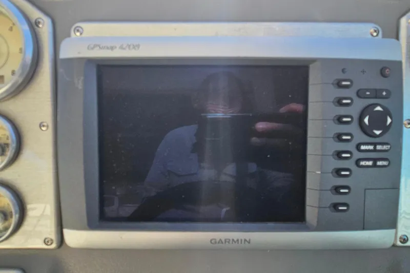 Slide: The Image of 2006 Cruisers Yachts 300 Express interior with seating, table, and kitchenette. - 15