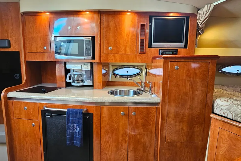 Slide: The Image of Sharp Aquos TV in 2006 Cruisers Yachts 300 Express interior. - 23