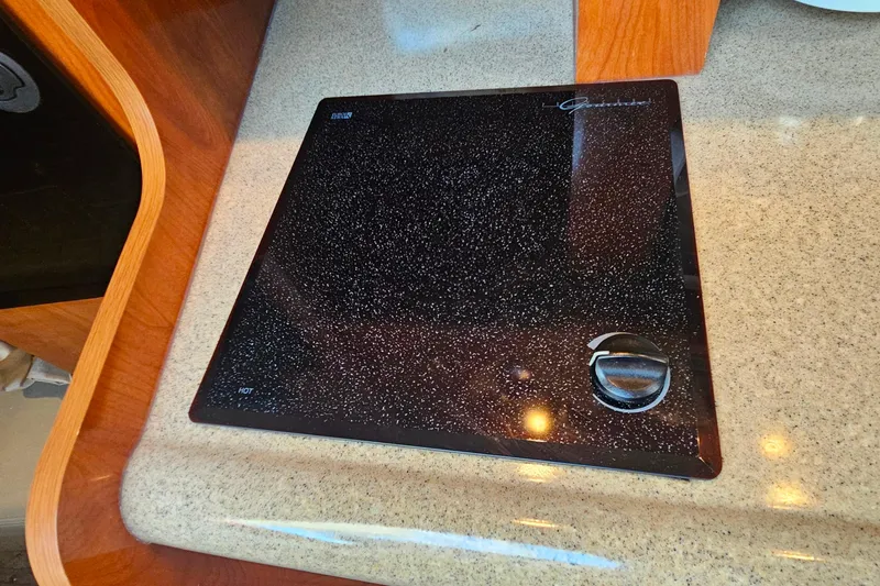 Slide: The Image of 2006 Cruisers Yachts 300 Express cabin interior with wood finishes and modern amenities. - 26