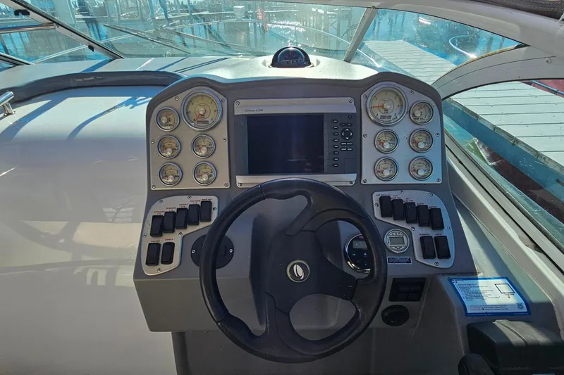 Slide: The Image of Garmin GPSmap 4208 on 2006 Cruisers Yachts 300 Express dashboard. - 14