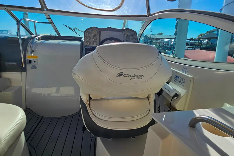 Slide: The Image of Luxurious 2006 Cruisers Yachts 300 Express interior with kitchenette and cozy seating area. - 18