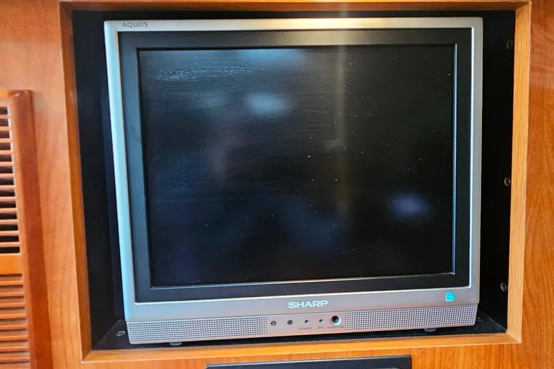 Slide: The Image of Microwave and coffee maker in 2006 Cruisers Yachts 300 Express kitchen area. - 24