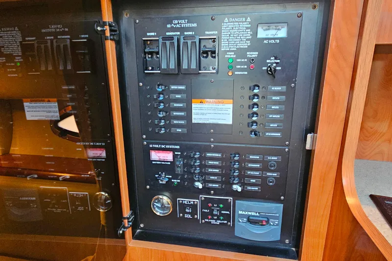 Slide: The Image of 2006 Cruisers Yachts 300 Express docked at marina under clear blue sky. - 33