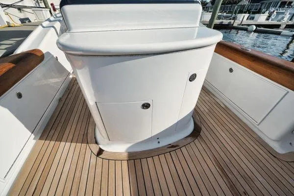 Slide: The Image of 2011 Winter Custom Yachts 29, teak deck, white cabinetry, docked at marina. - 30