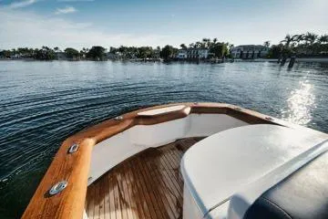 Slide: The Image of Bow view of 2011 Winter Custom Yachts 29 on calm water, showcasing wooden deck. - 31