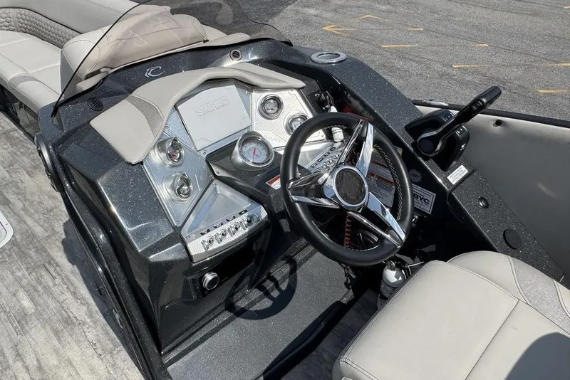 Slide: The Image of 2021 Crest Caribbean Platinum 250 SLS boat dashboard with steering wheel and controls. - 13