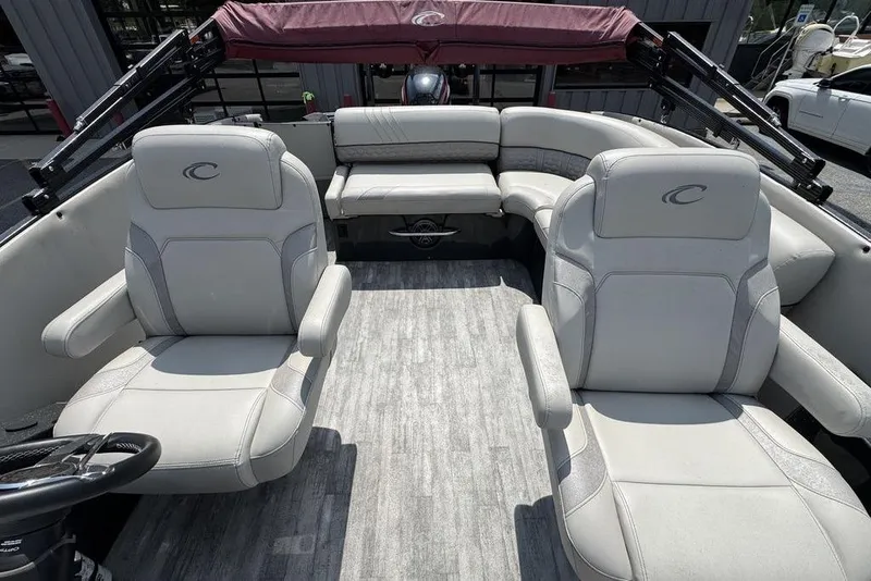 Slide: The Image of 2021 Crest Caribbean Platinum 250 SLS boat interior with plush seating and modern design. - 14
