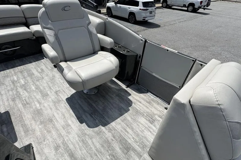 Slide: The Image of 2021 Crest Caribbean Platinum 250 SLS boat interior with luxurious seating and modern design. - 21