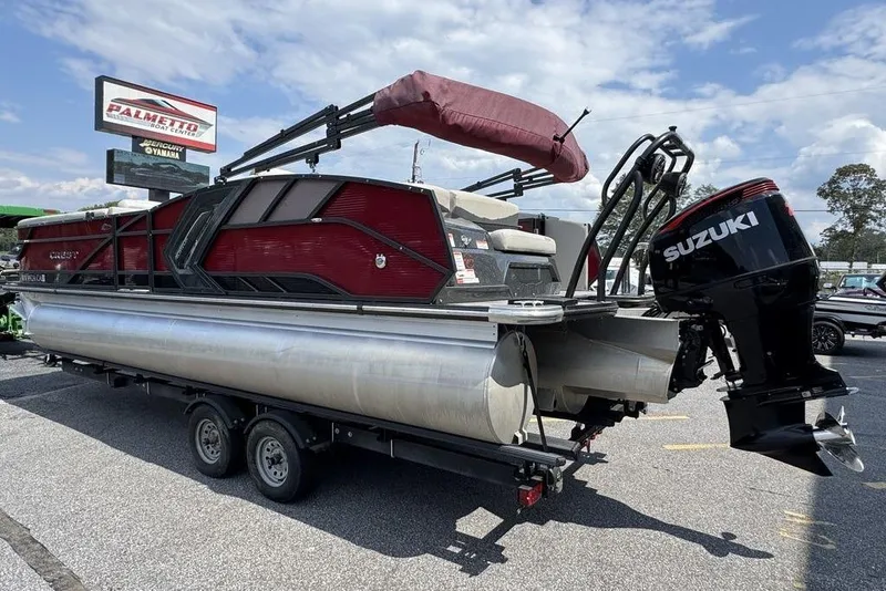 Slide: The Image of 2021 Crest Caribbean Platinum 250 SLS pontoon boat with Suzuki outboard motor on trailer. - 4