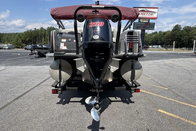 Slide: The Image of 2021 Crest Caribbean Platinum 250 SLS pontoon boat, rear view in parking lot. - 6