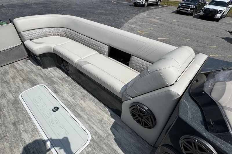 Slide: The Image of Luxurious seating on 2021 Crest Caribbean Platinum 250 SLS pontoon boat, featuring premium upholstery. - 8