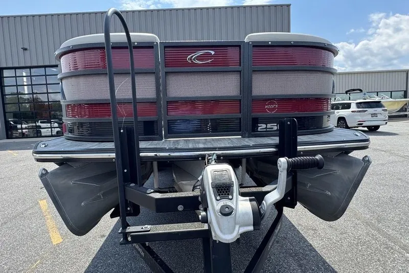 Slide: The Image of 2021 Crest Caribbean Platinum 250 SLS pontoon boat on trailer, rear view. - 9