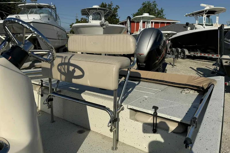 Slide: The Image of 2016 Xpress H20B Bay boat interior with steering wheel and seating. - 3