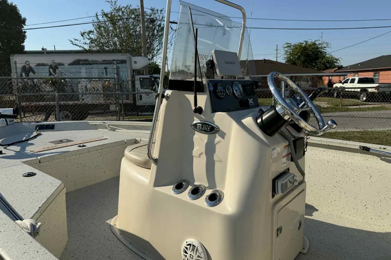 Slide: The Image of 2016 Xpress H20B Bay boat console with steering wheel and controls. - 4