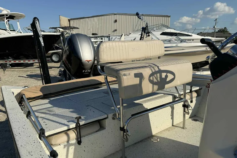 Slide: The Image of 2016 Xpress H20B Bay boat with Yamaha 115 engine, parked in a marina. - 8