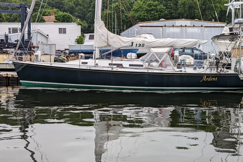 The Image of Sailboat J/130 "Ardent" docked, 1993 model by J Boats, with marina background. - 0