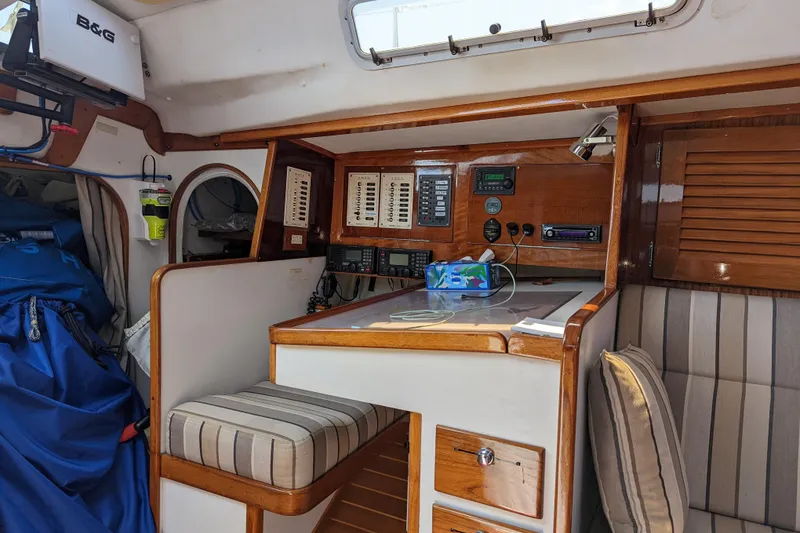 Slide: The Image of Interior of 1993 J Boats J/130 sailboat with navigation equipment and seating area. - 19