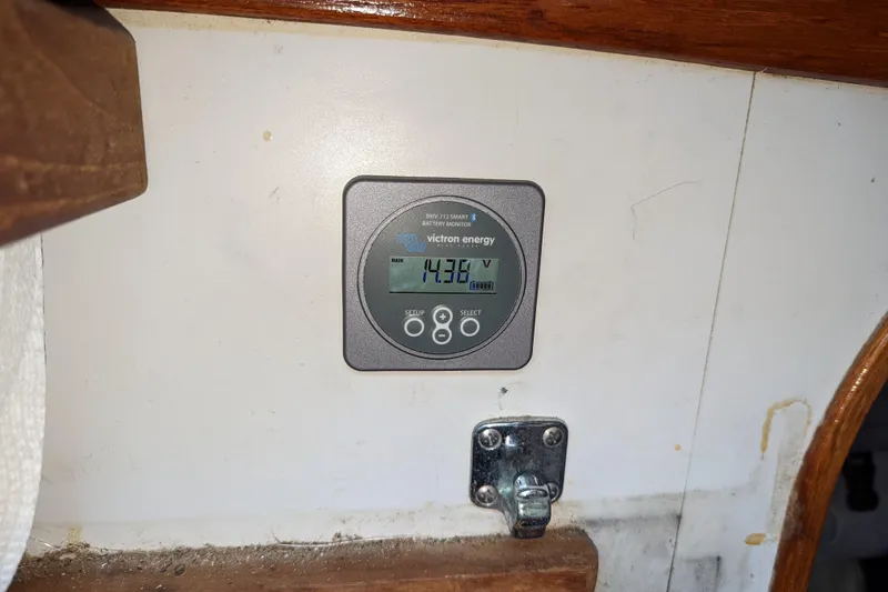 Slide: The Image of Victron Energy battery monitor on 1993 J Boats J/130 sailboat interior. - 25