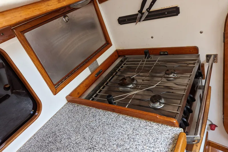 Slide: The Image of Galley kitchen in 1993 J Boats J/130 sailboat with stove and countertop. - 28