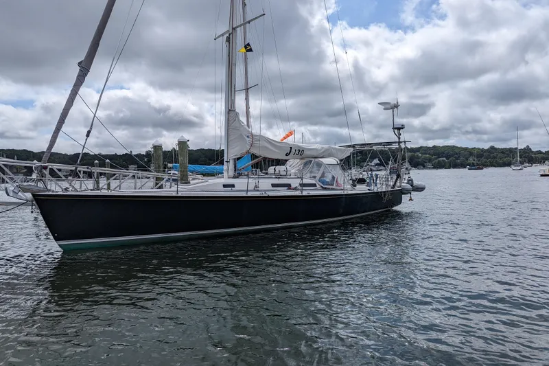 Slide: The Image of Sailboat J/130 by J Boats, 1993 model, anchored on a cloudy day. - 3