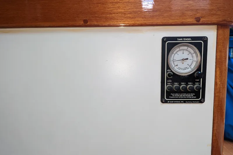 Slide: The Image of Tank tender gauge on 1993 J Boats J/130 yacht interior panel. - 30