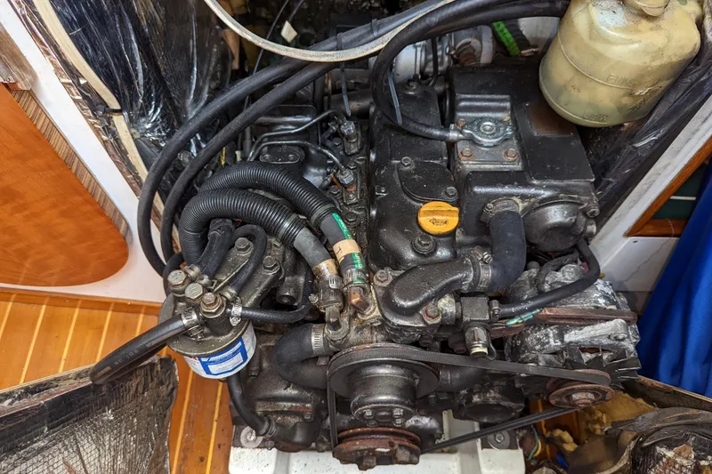 Slide: The Image of Engine compartment of a 1993 J Boats J/130 sailboat, showcasing mechanical components. - 41