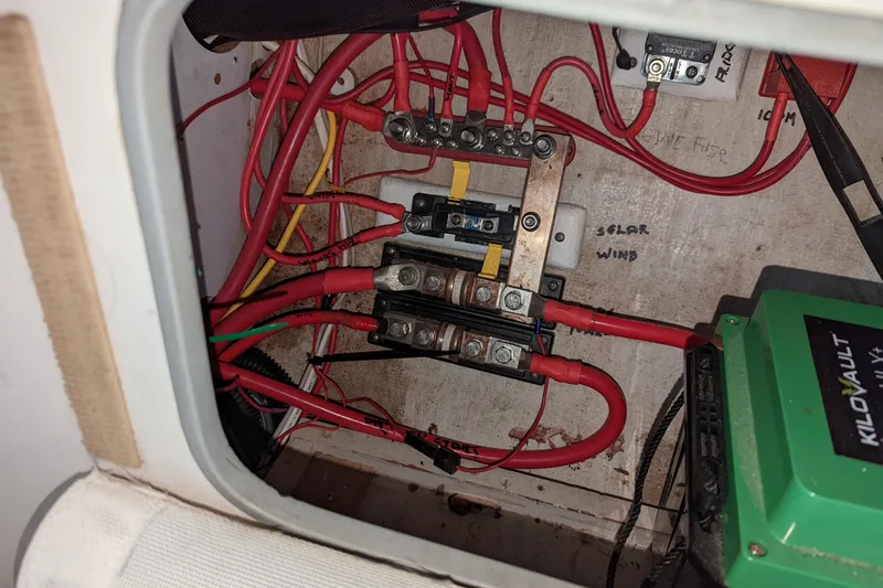 Slide: The Image of Electrical wiring setup inside a 1993 J Boats J/130 sailboat, featuring Kilovault components. - 43