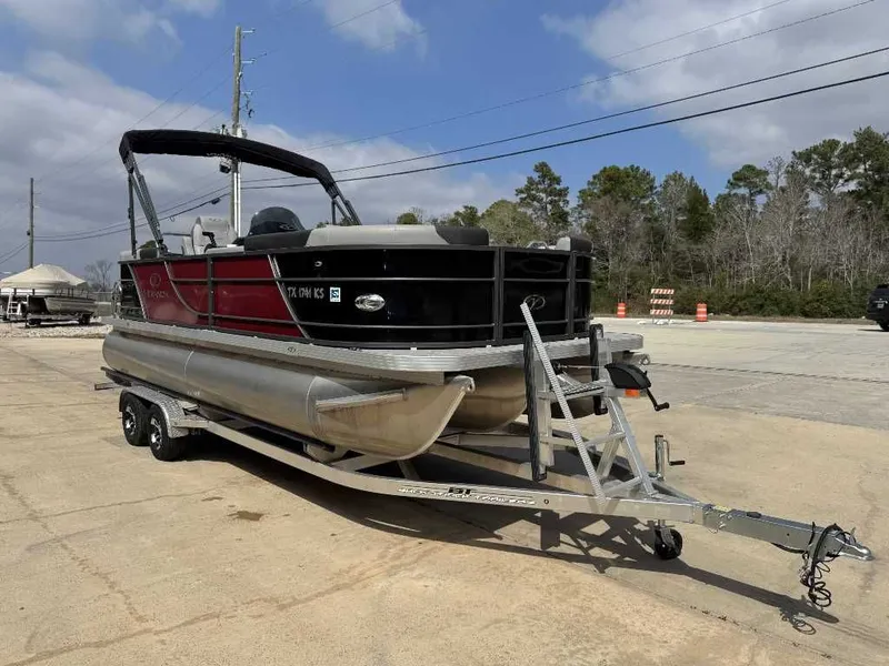 Slide: The Image of 2023 Veranda VR20RC pontoon boat parked on trailer outdoors. - 16