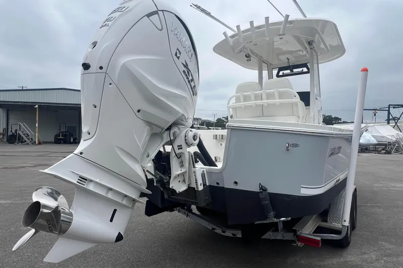 Slide: The Image of 2024 Regulator 26XO boat with Yamaha outboard engine, parked on a trailer. - 3
