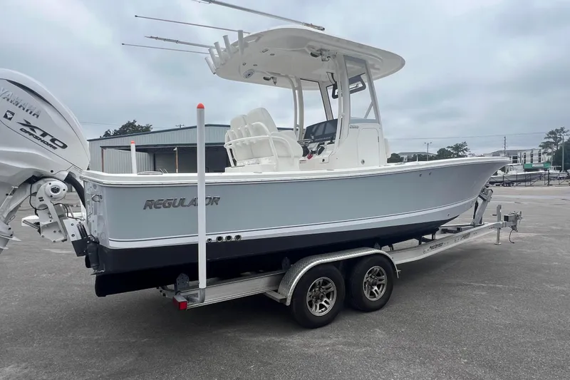 Slide: The Image of 2024 Regulator 26XO boat on trailer with Yamaha 250 outboard engine. - 4