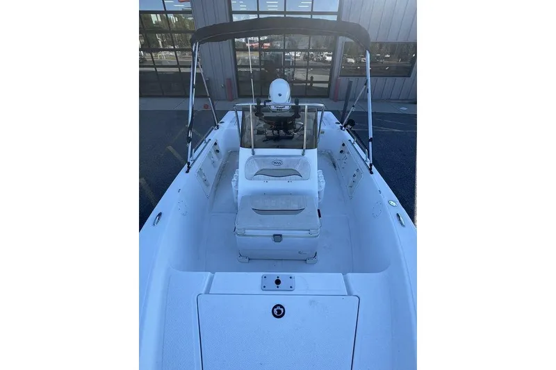 Slide: The Image of 2011 Key West 176 Bay Reef boat interior with seating and console. - 10