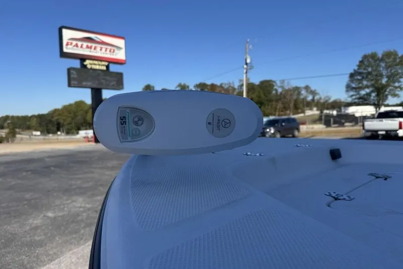 Slide: The Image of 2011 Key West 176 Bay Reef boat with trolling motor, outdoor dealership setting. - 12