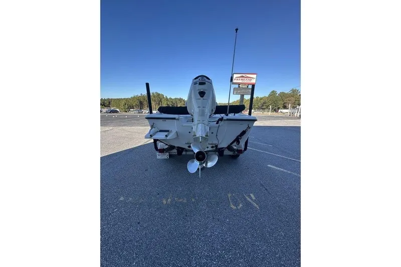 Slide: The Image of 2011 Key West 176 Bay Reef boat parked in a lot, rear view. - 5