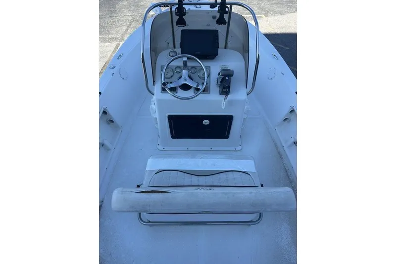 Slide: The Image of 2011 Key West 176 Bay Reef boat interior with steering console and seating. - 7