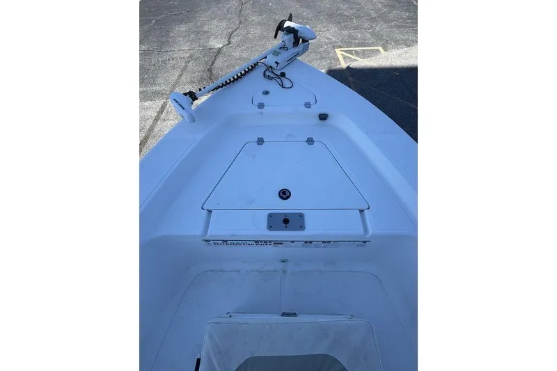 Slide: The Image of 2011 Key West 176 Bay Reef boat deck with trolling motor and storage compartment. - 9