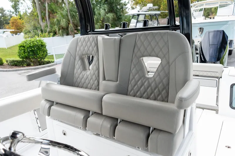 Slide: The Image of 2025 Sportsman Open 322 Center Console boat with luxurious seating and modern design. - 13