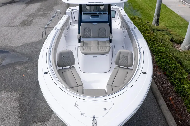 Slide: The Image of 2025 Sportsman Open 322 Center Console boat with spacious seating and sleek design. - 2