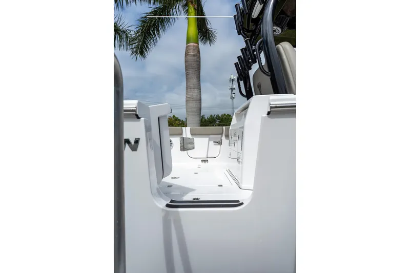 Slide: The Image of 2025 Sportsman Open 322 Center Console boat deck with palm tree background. - 21