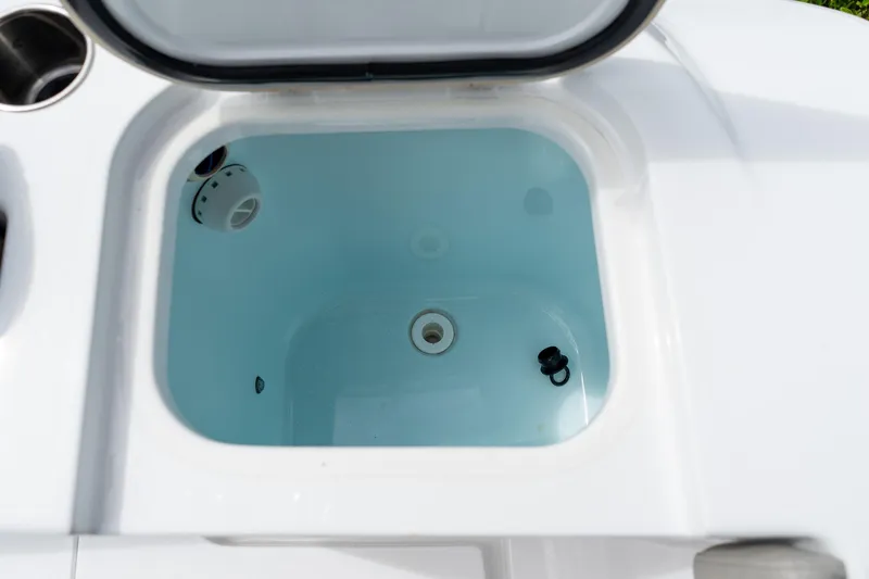 Slide: The Image of Livewell on 2025 Sportsman Open 322 Center Console boat, open lid view. - 25