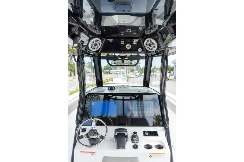 Slide: The Image of 2025 Sportsman Open 322 Center Console dashboard with advanced navigation and control systems. - 30