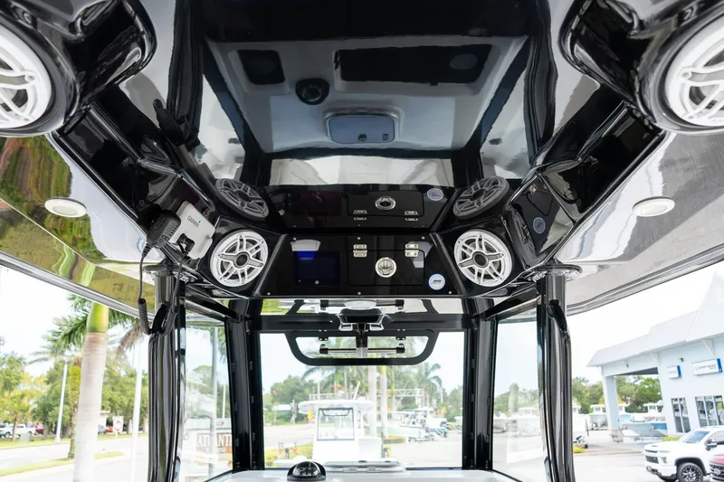 Slide: The Image of Interior view of 2025 Sportsman Open 322 Center Console with advanced audio system. - 31