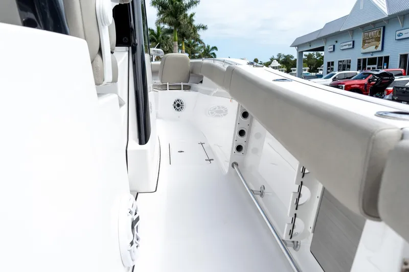 Slide: The Image of 2025 Sportsman Open 322 Center Console boat interior with seating and storage features. - 34
