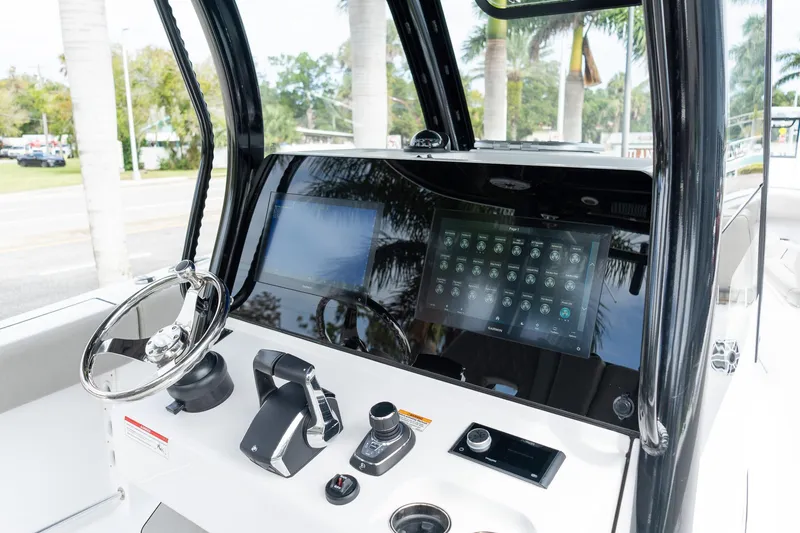 Slide: The Image of 2025 Sportsman Open 322 Center Console dashboard with modern controls and touchscreen display. - 35