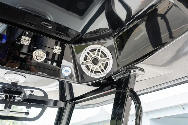 Slide: The Image of 2025 Sportsman Open 322 Center Console boat interior with speaker and control panel. - 37