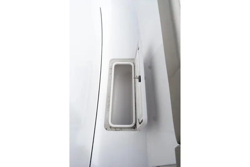 Slide: The Image of Open storage compartment on 2025 Sportsman Open 322 Center Console boat. - 39