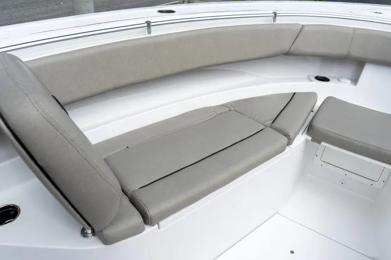 Slide: The Image of 2025 Sportsman Open 322 Center Console boat seating area with cushioned benches. - 41