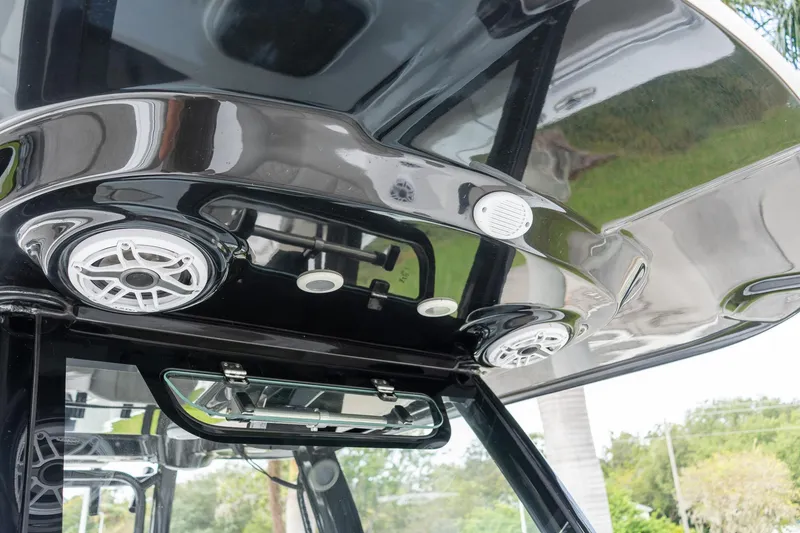 Slide: The Image of 2025 Sportsman Open 322 Center Console boat speakers and roof detail. - 8