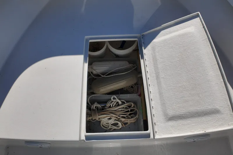 Slide: The Image of Open storage compartment on 2016 Albury Brothers 23 boat with ropes and equipment. - 18