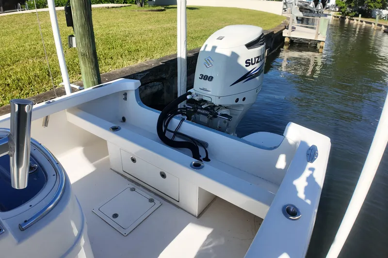 Slide: The Image of 2016 Albury Brothers 23 boat with Suzuki 300 outboard motor docked by the water. - 20