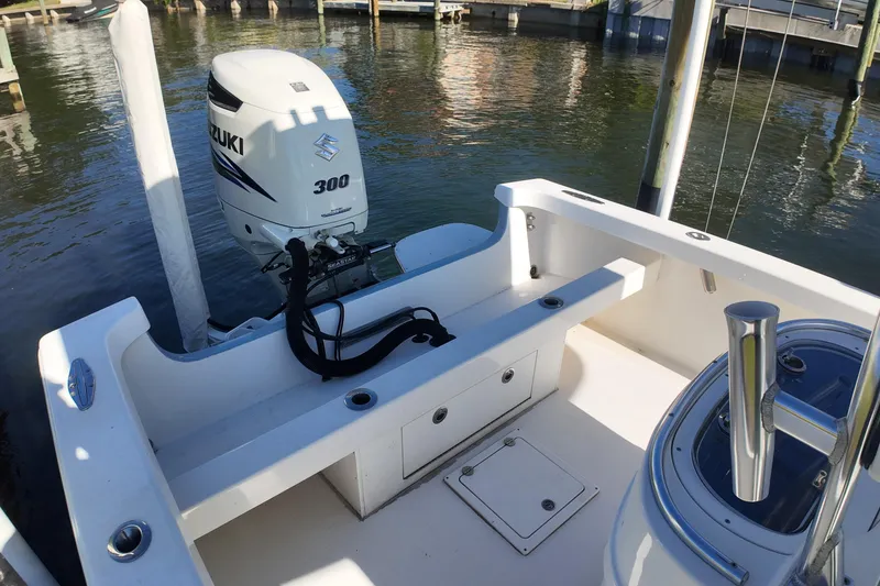 Slide: The Image of 2016 Albury Brothers 23 boat with Suzuki 300 outboard motor, docked in marina. - 21